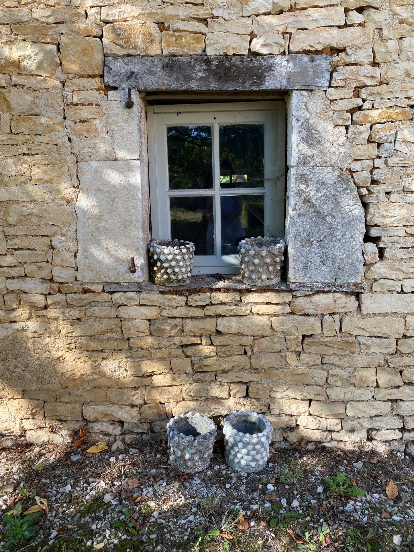 Cache-pot en pierre et coquillages